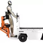 Side of Motrec MS-260 Stock Chaser utility vehicle with demo person standing up.