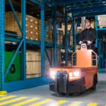 Motrec MS-260 Stock Chaser driving through warehouse.