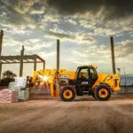 JCB 508-66TC tool carrier telescopic handler lifting pallet of materials.