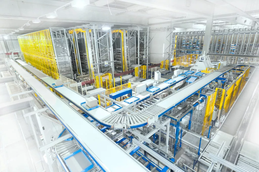 SSI Schaefer conveyor system throughout warehouse.