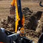 JCB 3CX Compact Backhoe Loader digging from operators view.