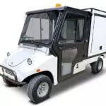 Columbia Utilitruck utility vehicle with cab and custom bed cover.