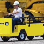 Columbia Payloader being driven outdoors on gravel road.