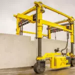 Combilift COMBI-SC3 Special Applications Straddle Carrier transporting concrete.