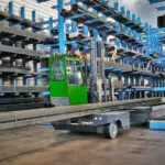 Combilift SL12000 sideloader forklift transporting steel.