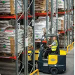 Combilift AC Electric Aisle Master in a warehouse with narrow aisles.