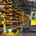 Combilift C-series C8000E electric forklift in steel warehouse.