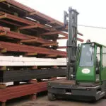 Combilift SL9000 Multi Directional Side Loader Forklift Truck getting material outdoors.