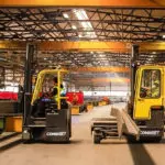 Combilift COMBI-CB Forklifts carrying supplies in heavy manufacturing and fabrication industry.