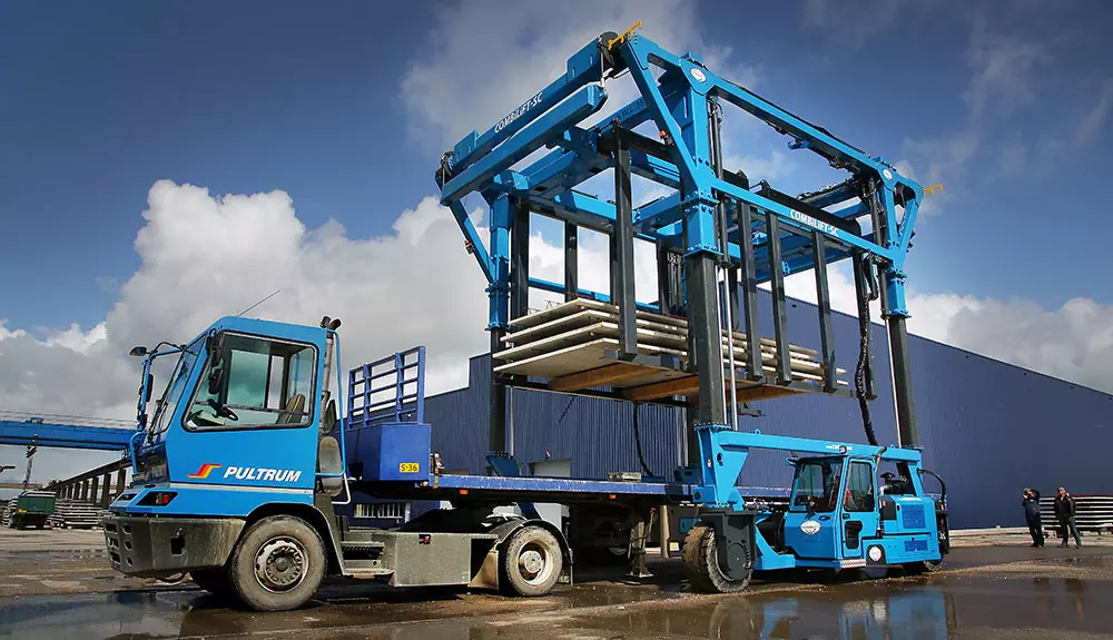 Combilift SC3 Telescopic Toplift straddle carrier handling concrete slabs.