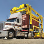 Combilift SC3 Telescopic Toplift straddle carrier handling containers.