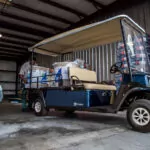 Cushman Shuttle 2 cargo bed full of materials.