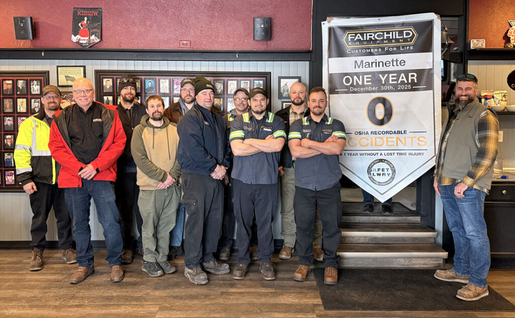 The team at Fairchild Equipment's Marinette, WI branch holding up a safety anniversary banner celebrating 1 year without an OSHA recordable injury in 2025.