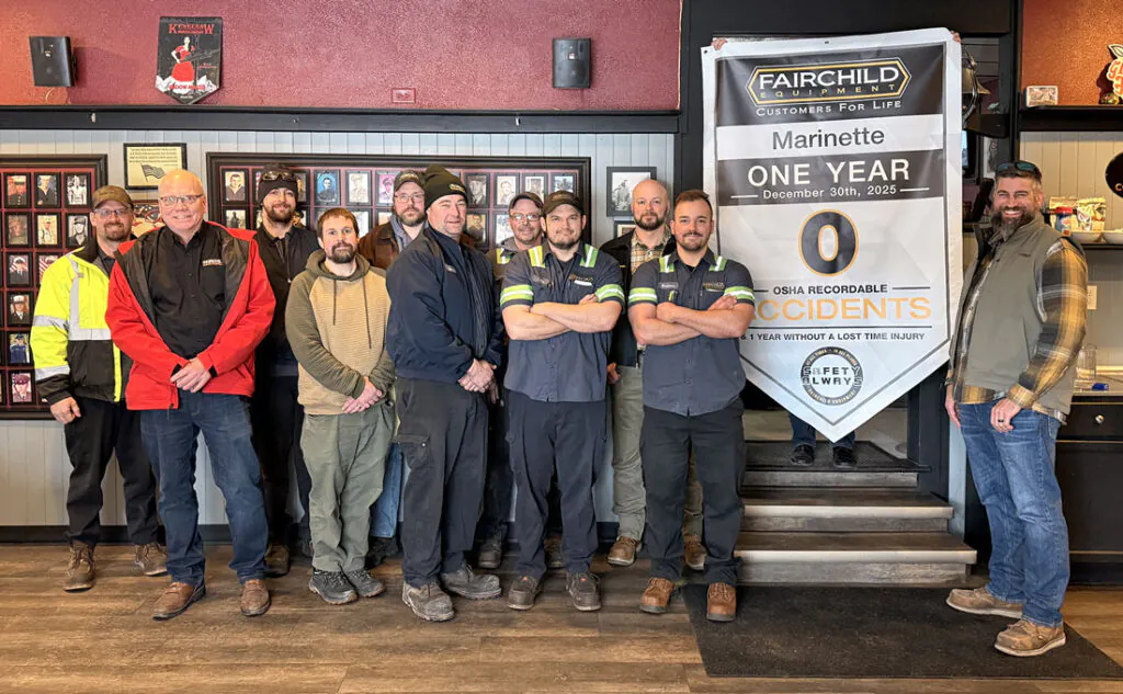 The team at Fairchild Equipment's Marinette, WI branch holding up a safety anniversary banner celebrating 1 year without an OSHA recordable injury in 2025.