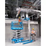 Genie GS-1930 raising repairman to repair ductwork.