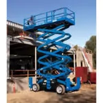 Genie GS-5390 RT scissor lift on construction site.