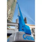 Back of Genie SX-180 with workers raised in bucket.