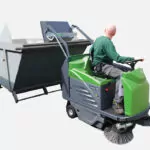 IPC Eagle 1280 rider sweeper dumping out hopper.