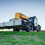 JCB 506-23TC carrying metal materials.