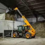 JCB 525-60 Agri Telehandler dumping dirt.