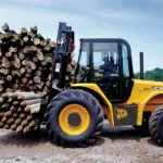 JCB 950 rough terrain forklift transporting lumber.