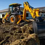 JCB 3CX-14 Backhoe Loader digging dirt.