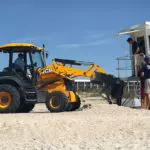JCB 3CX-15 Super Backhoe Loader on beach.
