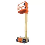 Elevated JLG 1230ES drivable vertical mast lift.