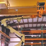 JLG E400AJPN articulating boom lift indoors.