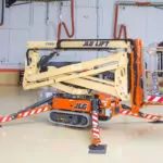 JLG X500AJ boom lift lowered.