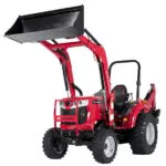 Mahindra 1635 compact utility tractor with raised bucket loader attachment.