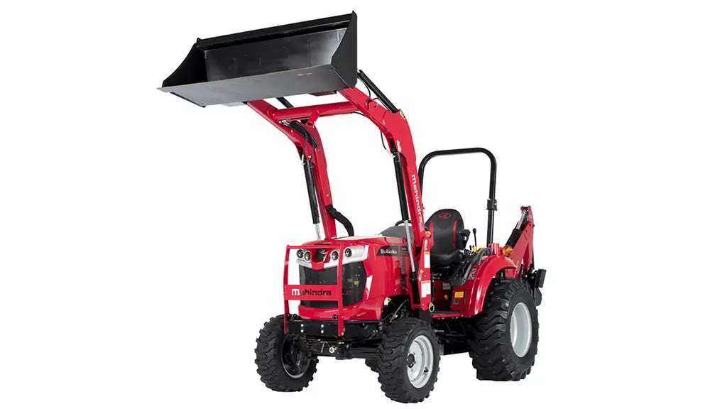 Mahindra 1635 compact utility tractor with raised bucket loader attachment.