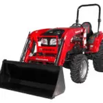Mahindra 1640 HST compact utility tractor with bucket loader attachment.