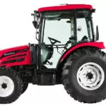Side view of Mahindra 2660 compact utility tractor with cab.