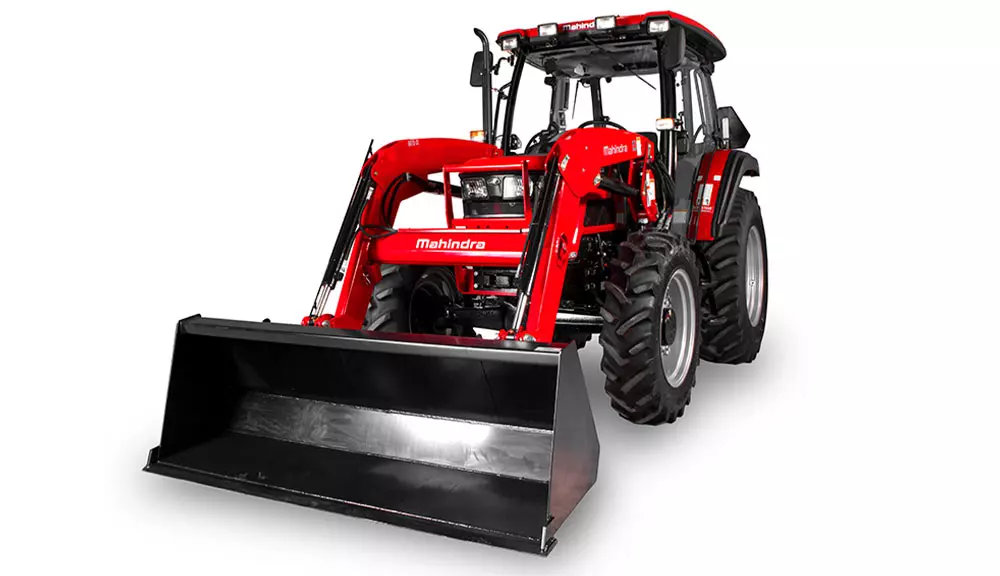 Mahindra 6075 utility tractor with cab and bucket attachment.