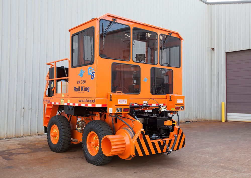 Rail King RK330 G6 railcar mover parked at outdoor facility.