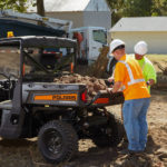 dirt being loaded into the bed of Polaris Commercial Pro XD Full-Size Gas utility vehicle