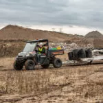 Polaris Commercial PRO XD Full-Size Diesel Utility Vehicle on dirt road.
