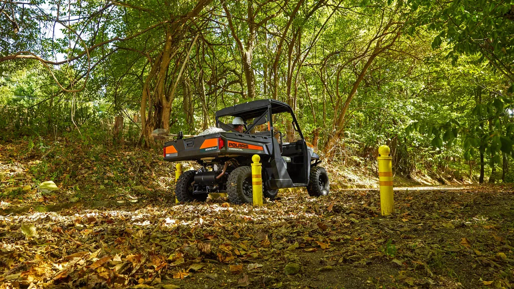 Polaris Commercial Pro XD Full-Size Gas utility vehicle on dirt trail.