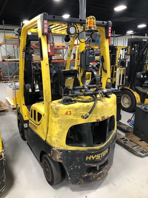 Hyster forklift angled back view.