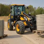 JCB 409 Wheel Loader construction and agriculture truck transporting materials.