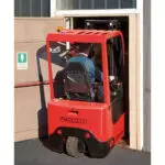Mariotti MX 16 compact microlift driving into doorway.