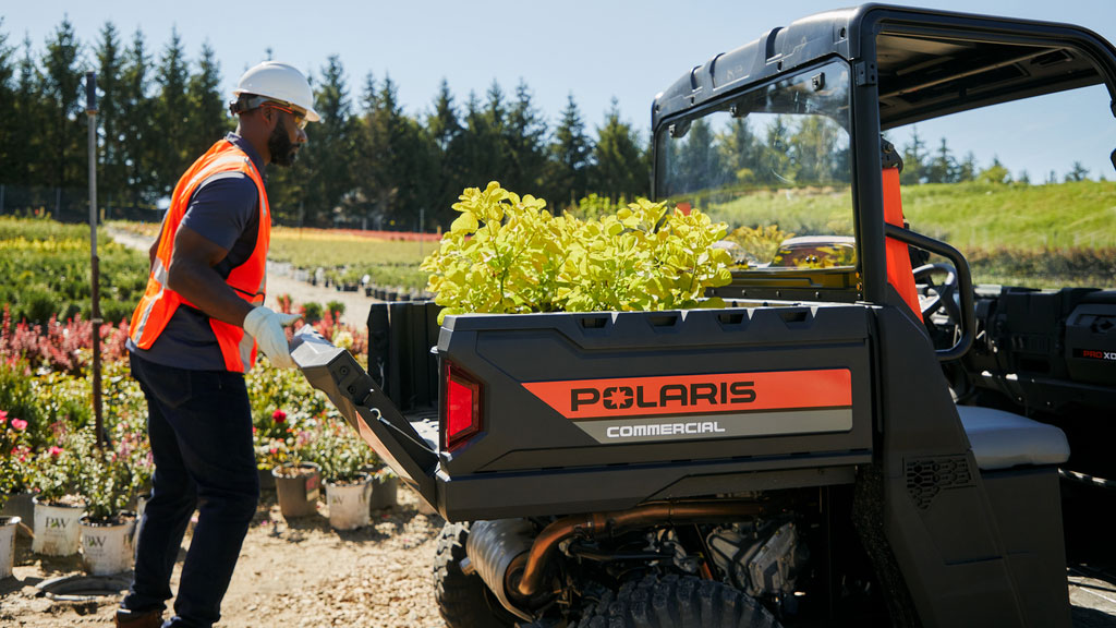 plants being loaded onto Pro XD Mid-Size Gas Utility Vehicle by Polaris Commercial.