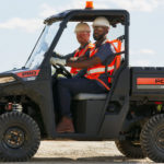 Pro XD Mid-Size Gas Utility Vehicle by Polaris Commercial in action on outdoor work site.
