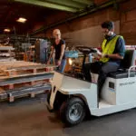 Taylor-Dunn SS-546 Personnel Carrier Utility Vehicle in action in workshop.