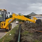 JCB 4CX-15 Super Backhoe Loader digging.