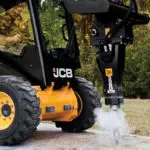 JCB 270W Skid Steer drilling into ground.