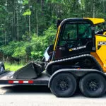JCB 2TS-7T skid steer loader on a trailer.