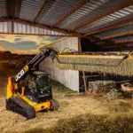 JCB 3TS-8T teleskid moving hay bales.