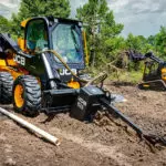 JCB 270W Skid Steer digging in dirt.